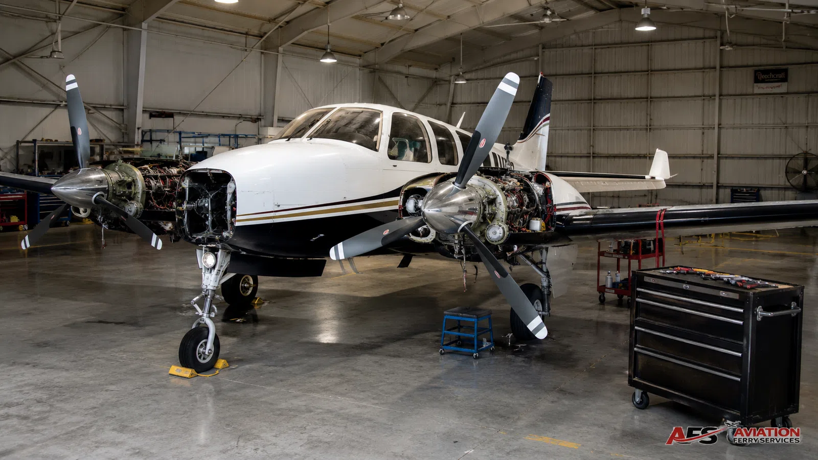 Aircraft inspection setting inside a maintenance hangar.