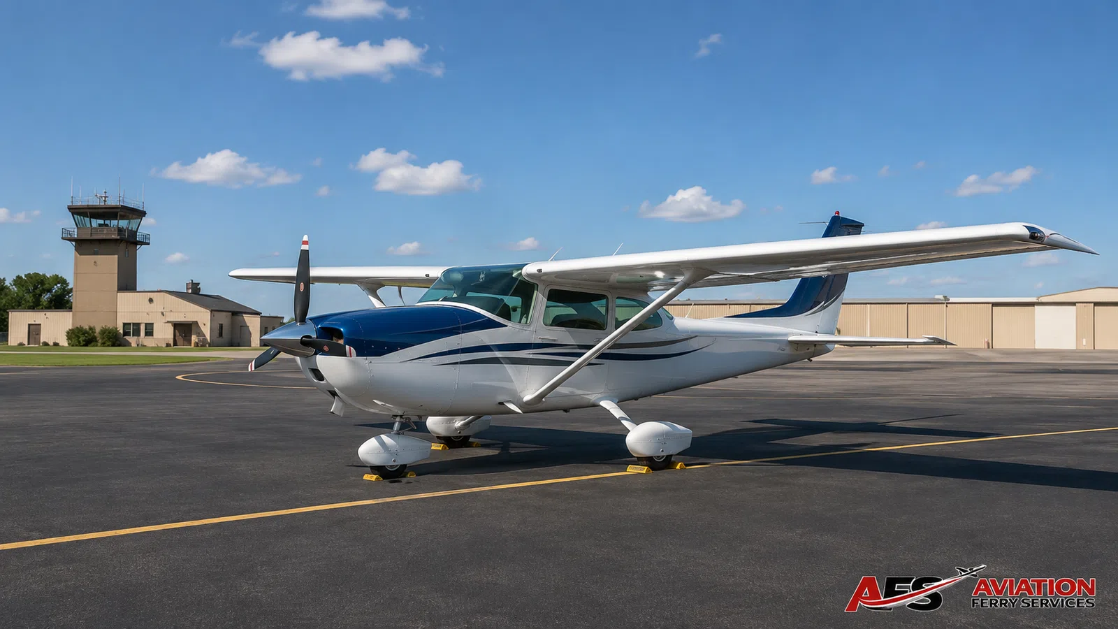 Single-engine high-wing piston aircraft parked on an airport ramp.