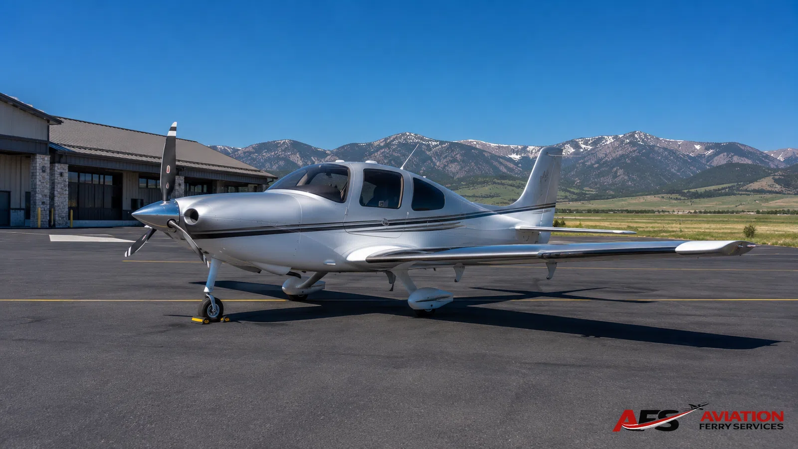 AFS aircraft photo — high-wing aircraft in valley airport setting